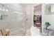 Bathroom with a walk-in shower, and access to a large walk-in closet at 960 Ladera Ranch Rd, Poinciana, FL 34759