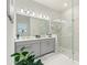 Spa-like bathroom featuring double sinks, a large shower, and modern fixtures at 960 Ladera Ranch Rd, Kissimmee, FL 34759