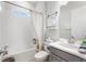 Clean bathroom with a tub, toilet and vanity at 960 Ladera Ranch Rd, Kissimmee, FL 34759