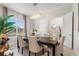 Elegant dining room with a large table and chandelier at 960 Ladera Ranch Rd, Poinciana, FL 34759