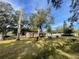 House with large yard and mature trees at 9732 8Th Ave, Orlando, FL 32824