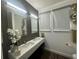 Modern bathroom with double vanity and updated fixtures at 3020 Cardillino Way, Kissimmee, FL 34741