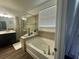 Relaxing bathroom with soaking tub and separate shower at 3020 Cardillino Way, Kissimmee, FL 34741