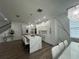 Modern kitchen with white cabinets and large island at 3020 Cardillino Way, Kissimmee, FL 34741