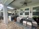 Covered patio with seating area, dining table, and a heater at 3020 Cardillino Way, Kissimmee, FL 34741