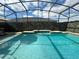 Inviting swimming pool with a screened enclosure at 3020 Cardillino Way, Kissimmee, FL 34741