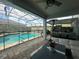 Relaxing view of the pool and patio from covered lanai at 3020 Cardillino Way, Kissimmee, FL 34741