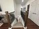 Modern staircase with dark wood railing and gray steps at 3020 Cardillino Way, Kissimmee, FL 34741