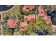 Bird's eye view of the community homes surrounded by mature trees and lake at 1000 Winderley Pl # 143, Maitland, FL 32751