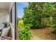 View of lush backyard from the patio door with beautiful scenery at 1000 Winderley Pl # 143, Maitland, FL 32751