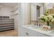 Bright bathroom featuring vanity with marble countertop, closet and plants at 1000 Winderley Pl # 143, Maitland, FL 32751