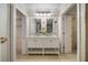 Bright bathroom featuring double vanity with marble countertop and white cabinets at 1000 Winderley Pl # 143, Maitland, FL 32751