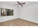 Inviting bedroom with laminate floors, a ceiling fan, and natural light at 1000 Winderley Pl # 143, Maitland, FL 32751