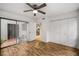 Bedroom with hardwood floors and sliding door leading to patio at 1000 Winderley Pl # 143, Maitland, FL 32751