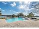 Enjoy the community pool with lounge chairs and beautiful lake view at 1000 Winderley Pl # 143, Maitland, FL 32751