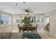 Open-concept dining room with travertine floors, elegant table setting, and seamless access to other living spaces at 1000 Winderley Pl # 143, Maitland, FL 32751