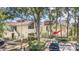 Charming condo exterior with well-maintained landscaping and covered parking at 1000 Winderley Pl # 143, Maitland, FL 32751