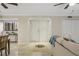 Elegant foyer with double doors, travertine floors, and an open view into the living and dining area at 1000 Winderley Pl # 143, Maitland, FL 32751