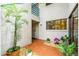 Inviting front entrance with a well-maintained tiled patio, lush greenery, and a charming exterior at 1000 Winderley Pl # 143, Maitland, FL 32751