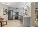 Modern kitchen featuring light blue cabinets, stainless steel appliances, and an open layout at 1000 Winderley Pl # 143, Maitland, FL 32751