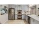 Updated kitchen features stainless steel appliances, light blue cabinets, and stylish countertops at 1000 Winderley Pl # 143, Maitland, FL 32751