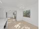 Open concept kitchen features stone countertops and eat-in nook with lush exterior views at 1000 Winderley Pl # 143, Maitland, FL 32751