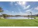 Scenic lake view with lush green lawn and path on the waters edge at 1000 Winderley Pl # 143, Maitland, FL 32751