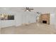 Open living room featuring travertine floors, fireplace, and modern lighting at 1000 Winderley Pl # 143, Maitland, FL 32751