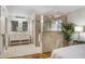 Ensuite main bathroom with a walk-in shower, double vanity, and modern fixtures at 1000 Winderley Pl # 143, Maitland, FL 32751