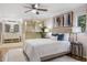 Spacious main bedroom with an ensuite bathroom, stylish decor, and comfortable bedding at 1000 Winderley Pl # 143, Maitland, FL 32751
