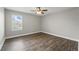 Bright bedroom featuring wood floors, neutral walls, crown molding, and a window with natural light at 10219 Atwater Bay Dr, Winter Garden, FL 34787