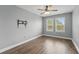 Simple bedroom featuring wood floors, neutral walls, crown molding, and a window with plantation shutters at 10219 Atwater Bay Dr, Winter Garden, FL 34787