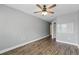 Simple bedroom featuring wood floors, neutral walls, crown molding, and a ceiling fan at 10219 Atwater Bay Dr, Winter Garden, FL 34787