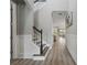 Hallway with wood floors leading to staircase and living area at 10219 Atwater Bay Dr, Winter Garden, FL 34787