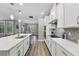 Modern kitchen with sleek countertops, stainless steel appliances, and wood floors at 10219 Atwater Bay Dr, Winter Garden, FL 34787