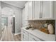 Bright kitchen with white cabinets and stainless steel appliances at 10219 Atwater Bay Dr, Winter Garden, FL 34787