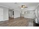 Large open living room with wood floors, crown molding, ceiling fan, and abundant natural light at 10219 Atwater Bay Dr, Winter Garden, FL 34787