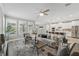 Bright living room features large windows, a comfortable sofa, and seamless transition to the kitchen at 10219 Atwater Bay Dr, Winter Garden, FL 34787
