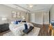 Comfortable main bedroom with a tray ceiling, plenty of natural light, and neutral decor at 10219 Atwater Bay Dr, Winter Garden, FL 34787