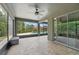 Screened in patio that overlooks a pool area surrounded by a lush yard at 10219 Atwater Bay Dr, Winter Garden, FL 34787