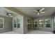 Covered patio with ceiling fans, tiled flooring, and multiple windows at 10219 Atwater Bay Dr, Winter Garden, FL 34787