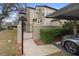Exterior view of charming two-story townhome with private gated entry and carport at 110 Becket Ln, Lake Mary, FL 32746