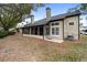 Exterior view of house with screened porch and yard at 110 Becket Ln, Lake Mary, FL 32746