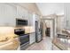 Modern kitchen with stainless steel appliances and granite countertops at 110 Becket Ln, Lake Mary, FL 32746