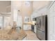 Modern kitchen with stainless steel appliances and granite countertops at 110 Becket Ln, Lake Mary, FL 32746