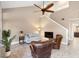 Living room with vaulted ceiling, fireplace, and comfortable seating at 110 Becket Ln, Lake Mary, FL 32746