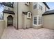 Brick paved patio adjacent to the townhome, featuring a private entrance at 110 Becket Ln, Lake Mary, FL 32746