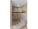 Large walk-in shower with tiled walls and built-in seat at 110 Becket Ln, Lake Mary, FL 32746