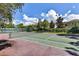 Community tennis court with green surface at 110 Becket Ln, Lake Mary, FL 32746