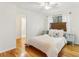 Cozy bedroom with a comfortable bed and hardwood floors at 1120 Portland Ave # 4, Orlando, FL 32803